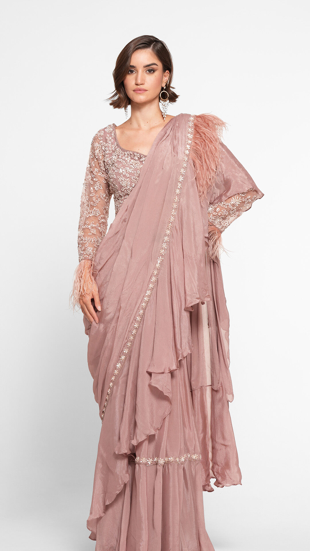 An Indo-Western saree paired with a sleek, elegant hairstyle for a modern, refreshing look.